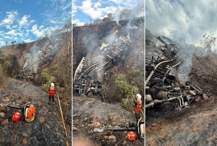 Motorista morre após carreta cair em ribanceira e pegar fogo
